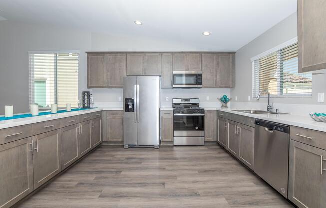 a large kitchen with stainless steel appliances
