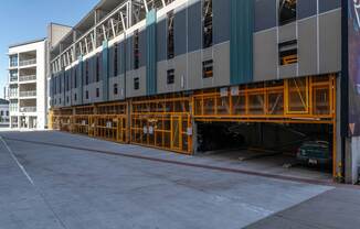 the side of a building with yellow scaffolding