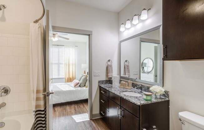 Carillon Apartments in Nashville, TN 37219 photo of a bathroom with a mirror and a shower and a sink