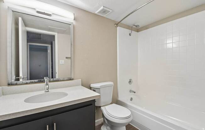 A bathroom with a white toilet and sink.