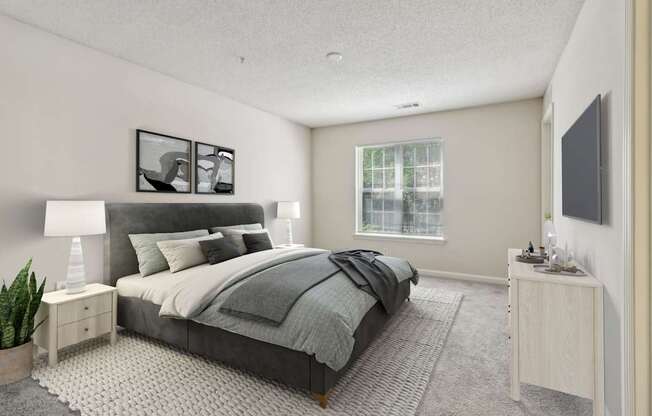 A bedroom with a large bed and a window.