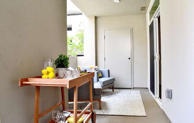 A table with lemons and glasses on it.
