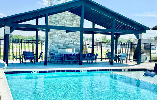 A pool with a glass divider and a black fence.