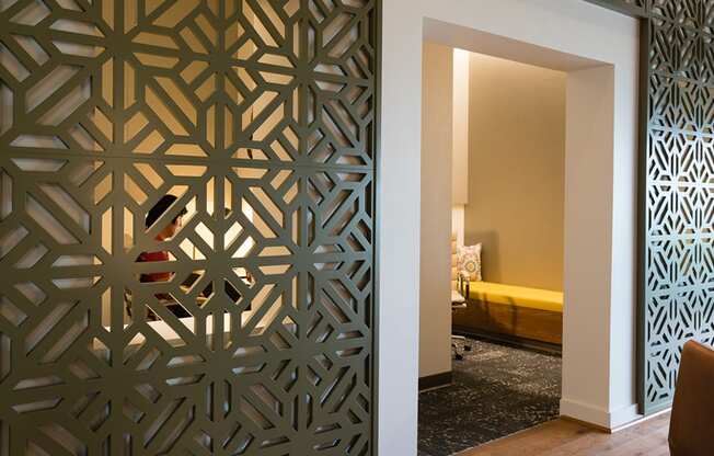 a room with a door that has been decorated with a laser cut screen