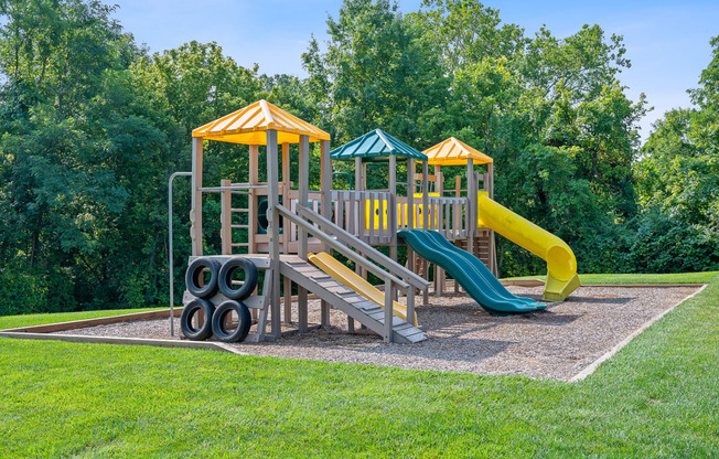 a playground with a slide and other playground equipment