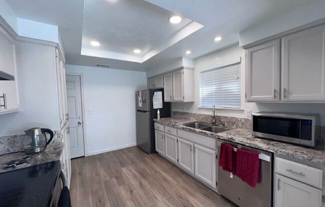 Updated kitchen, laminate floors throughout, close to shopping and transportation.