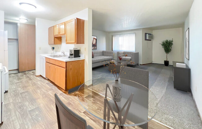 A modern kitchen with wooden cabinets and a glass table.
