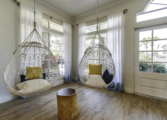 two hanging hammock chairs in a living room