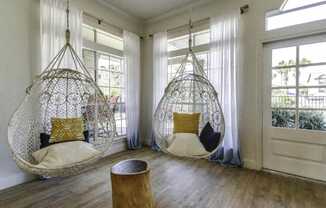 two hanging hammock chairs in a living room