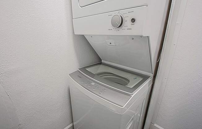 the laundry room has a washer and dryer and a sink