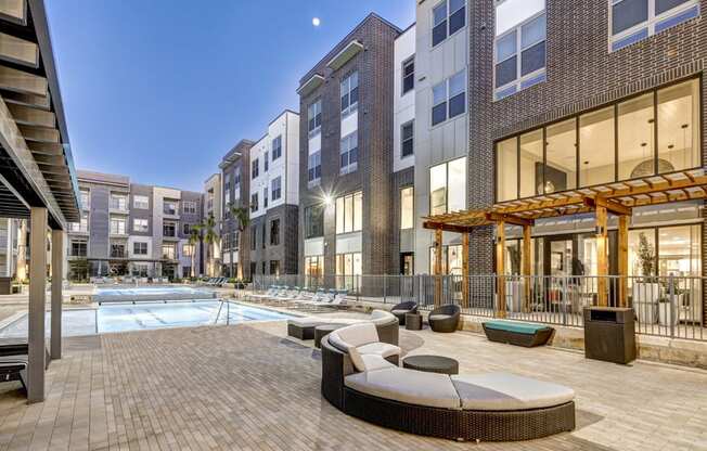 apartments with a swimming pool at dusk at Arise Riverside, Austin Texas