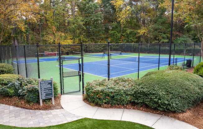 a tennis court with a fence around it