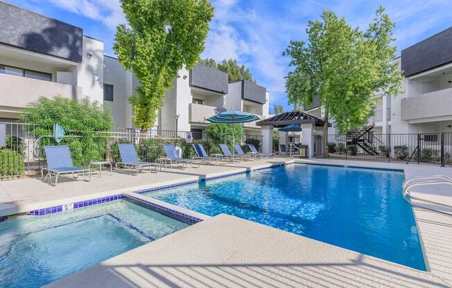 a house with a pool in front of a building