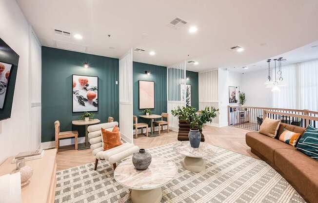 A living room with a couch, chairs, and a coffee table.
