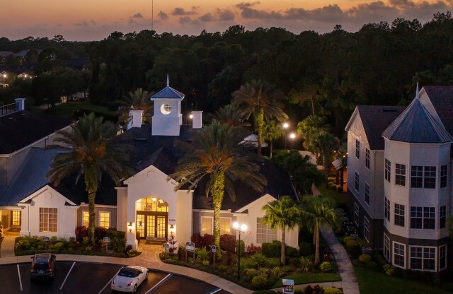 Exterior view of Avana Westchase's clubroom at dusk.