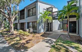 External Community apartment building with walkway at Huntington Place in Sarasota, Florida.