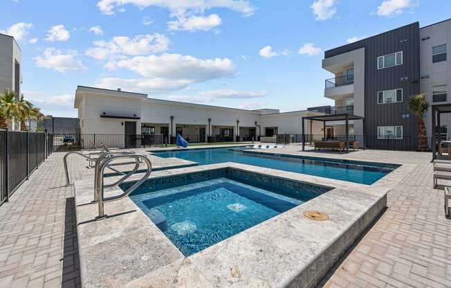 a swimming pool with a building in the background