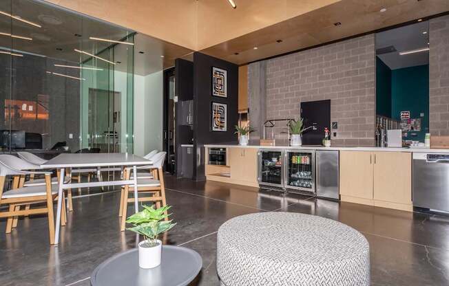 A modern kitchen with a dining table and chairs.