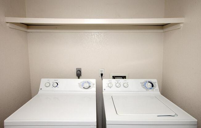 a white microwave oven sitting on top of a stove