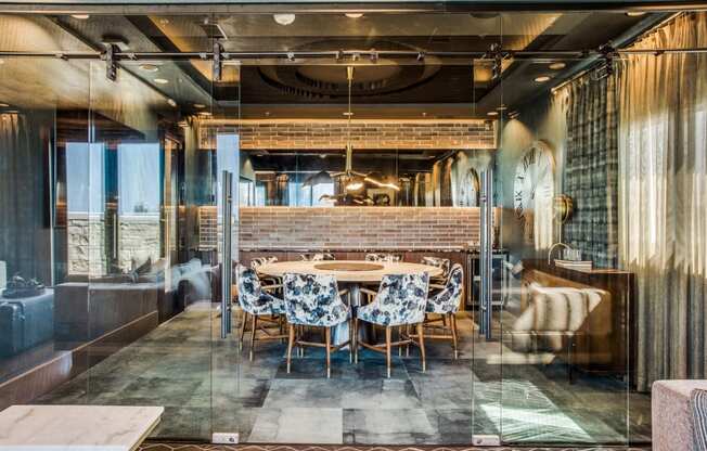 a dining room with a long table in the middle of it