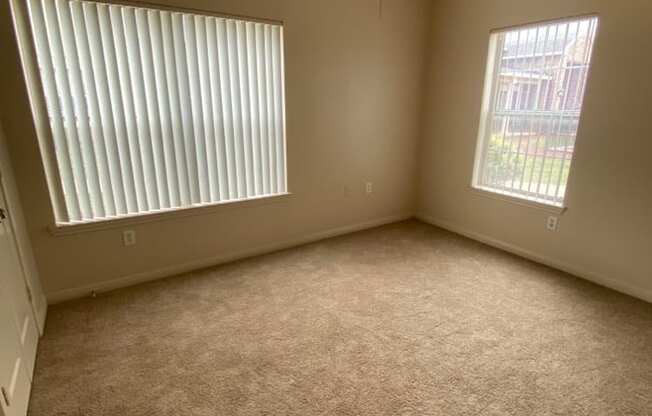 a bedroom with a bed and a ceiling fan