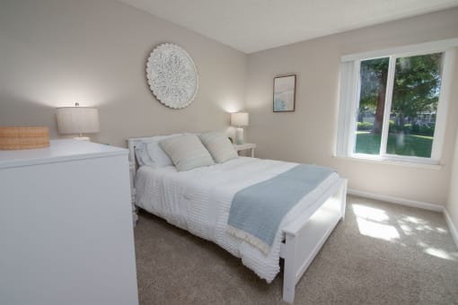 Model apartment Spare bedroom with a bed and a window
