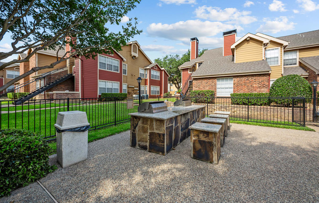 A sunny day at a residential area with houses and a park.