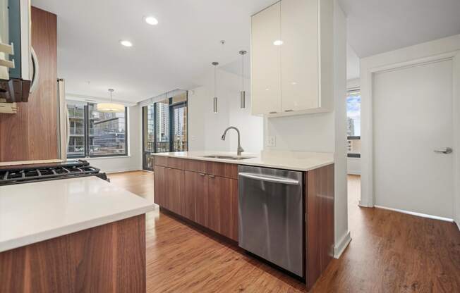 Modern kitchen with stainless steel appliances apartments downtown Chicago 60654 at Hensley Chicago, Illinois