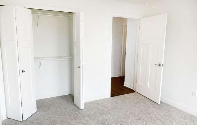 A bedroom with a large closet at Meadowbrooke Apartment Homes in Kentwood, MI 49512