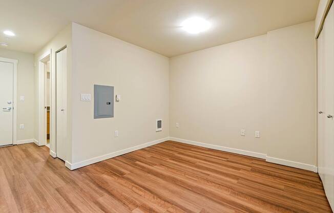 A room with wooden floors and a white ceiling.