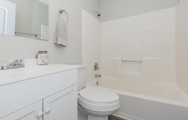 a room with a sink and a mirror