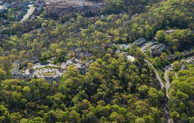 an aerial view of a neighborhood with trees and buildings