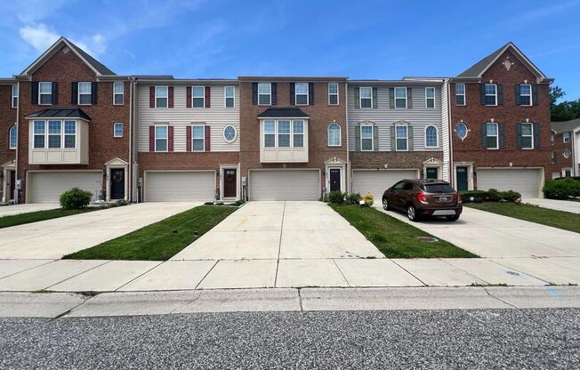 Welcome to this beautiful 3 bedroom, 2.5 bathroom brick front townhome in Greenway Farms!