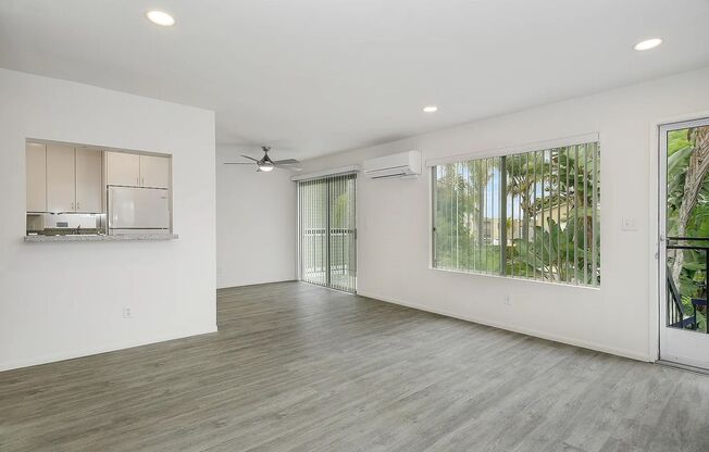 FABULOUS location!  4 blocks to the ocean & Sail Bay, AIR-CONDITIONING, IN-UNIT LAUNDRY! PRIVATE GARAGE + Addn Parking