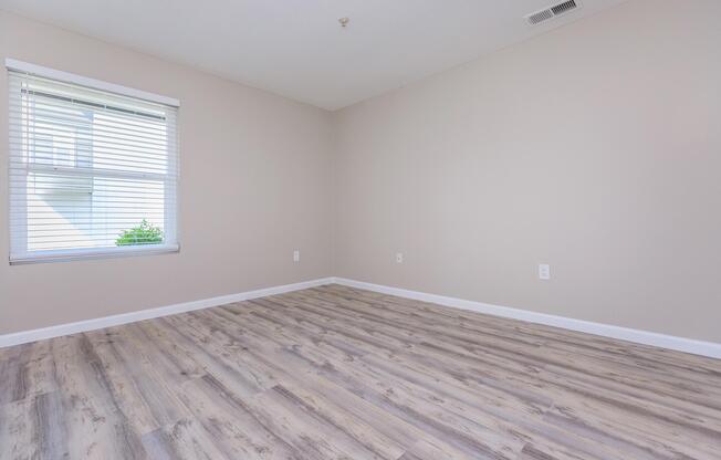 a bedroom with a large window