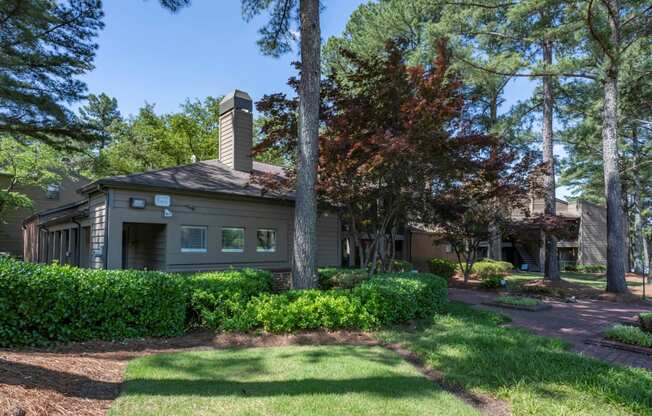 the front of a house with a lawn and trees at The Summit Apartments, Tennessee, 38128