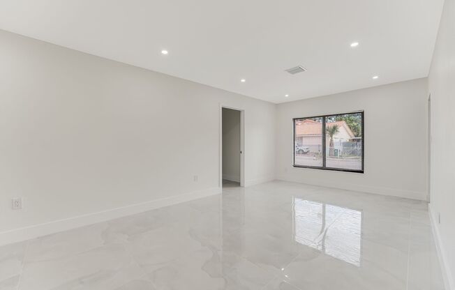 Beautifully renovated 4 bed 2 bath home with a large backyard and parking.