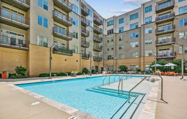 a swimming pool in front of an apartment building at Link Apartments Innovation Quarter, North Carolina