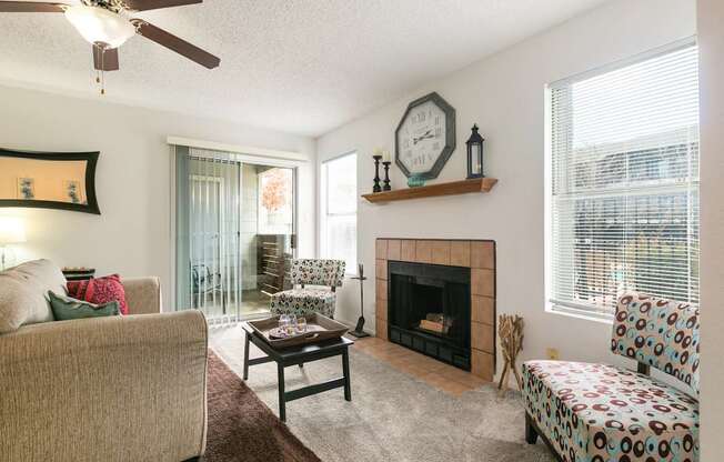 A living room with a fireplace and a couch.