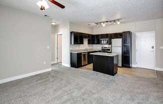 Kitchen with modern appliances at Tamarin Ridge in Lincoln, NE