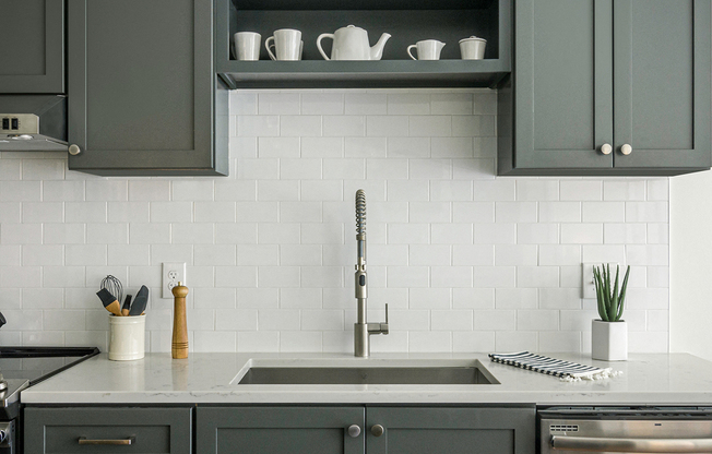 Quarter kitchens feature shaker-style cabinets and ceramic backplash