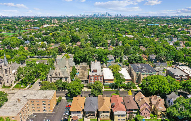 A bird's eye view of a residential area with houses and trees.