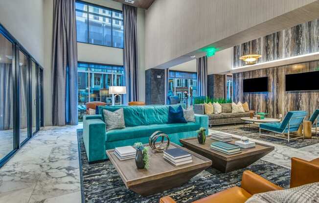 A modern living room with a blue couch and a coffee table.