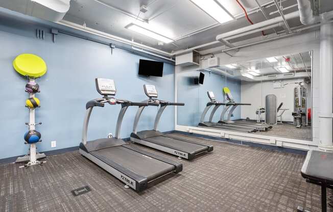 fitness center with cardio equipment