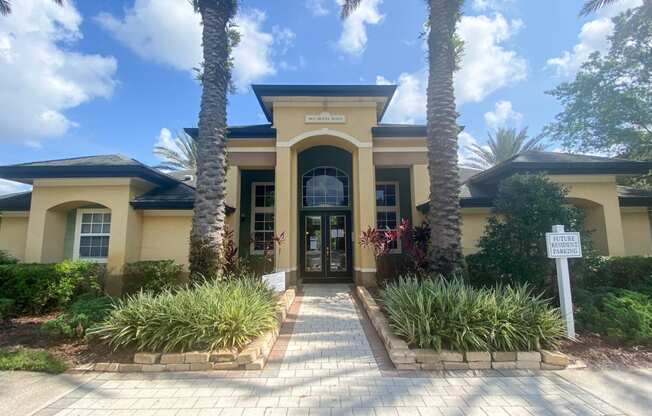 Leasing office exterior with native landscaping