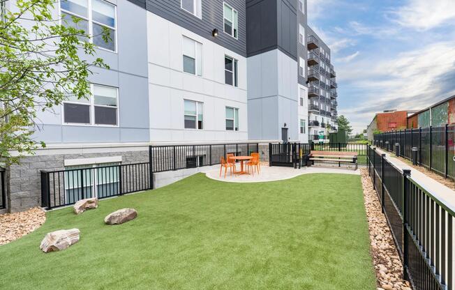 Expansive dog park with open play space and seating, perfect for your four-legged friends.