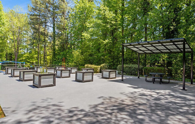 Outdoor Planter Boxes and Canopy Area at Dunwoody Village Apartments in Atlanta, GA.