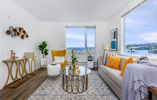 a living room with a couch and two windows at Jefferson Yards, Washington