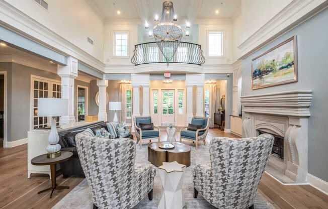 A living room with a fireplace and a chandelier.
