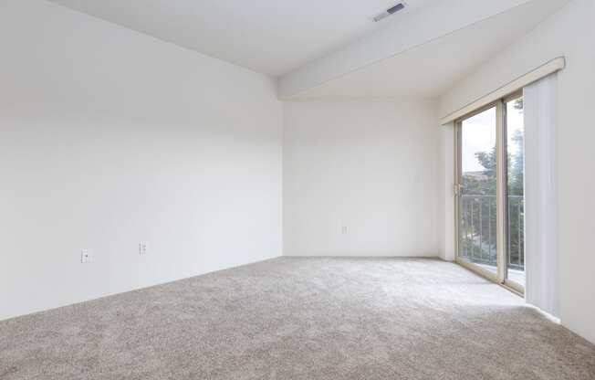 a room with carpet and a window  at Shoreline Village, Richland, WA